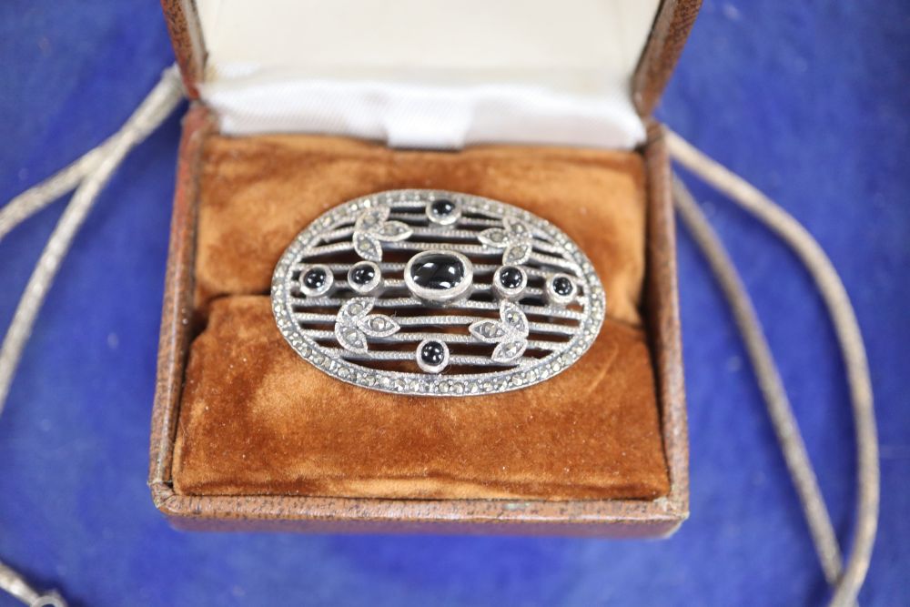 A Siamese filigree white metal and niello necklace and a marcasite brooch.
